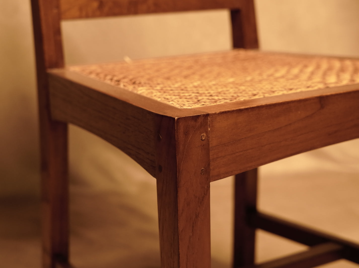 Vintage style handcrafted chair made of wood and natural rattan