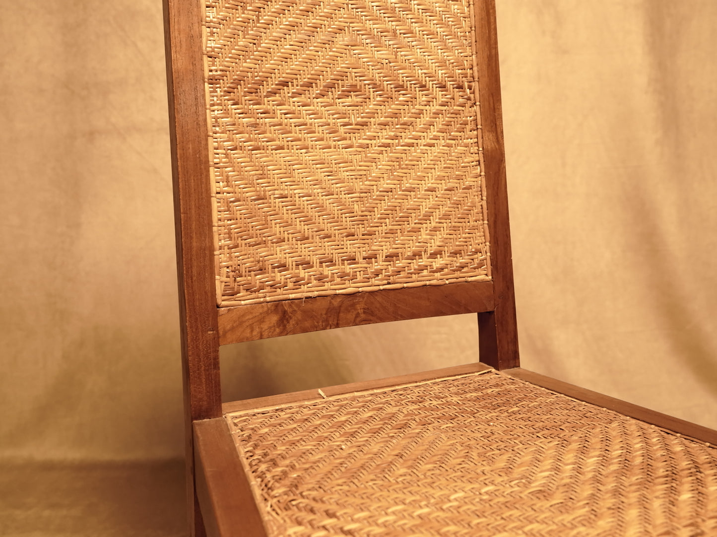 Vintage style handcrafted chair made of wood and natural rattan