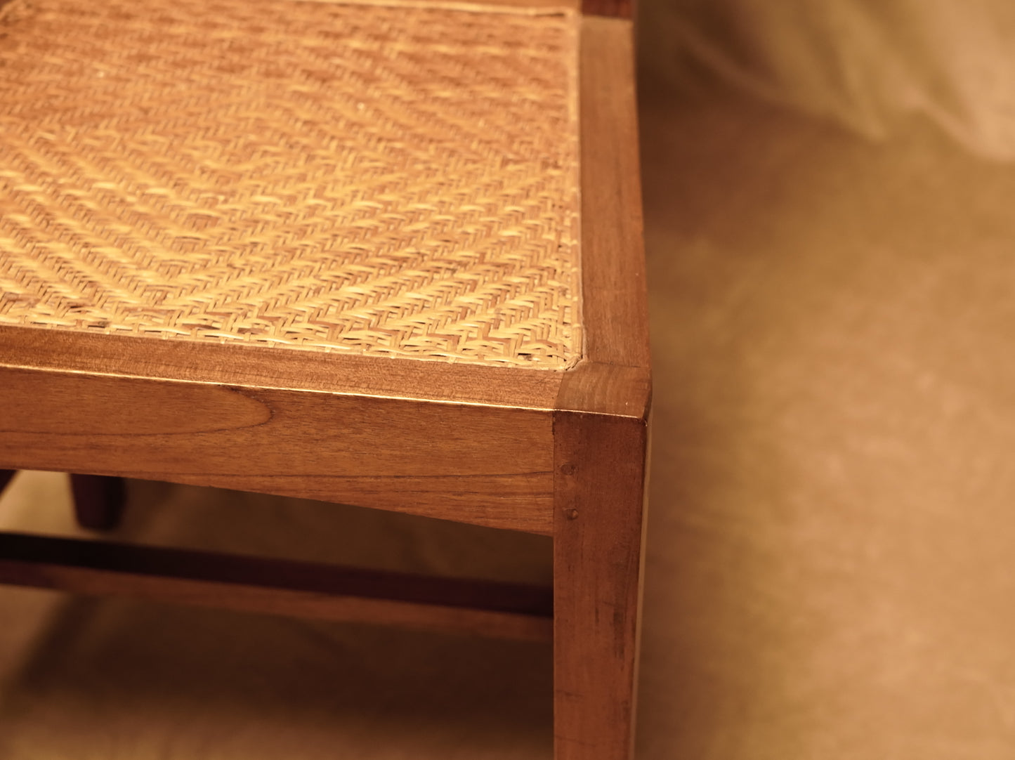 Vintage style handcrafted chair made of wood and natural rattan