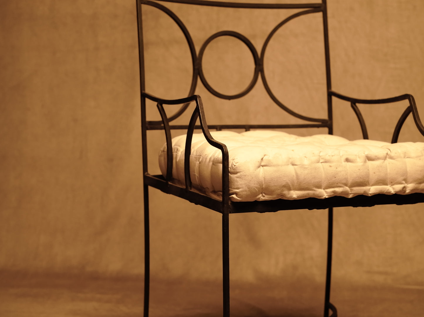 Wrought iron armchair with classic vintage style cushion