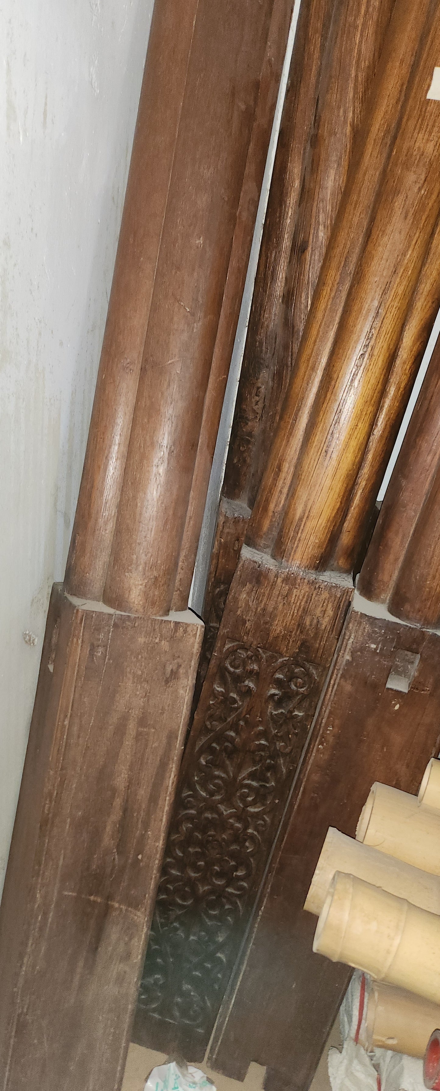 Carved wooden cornice and columns with wrought iron railing, Indonesian handicraft