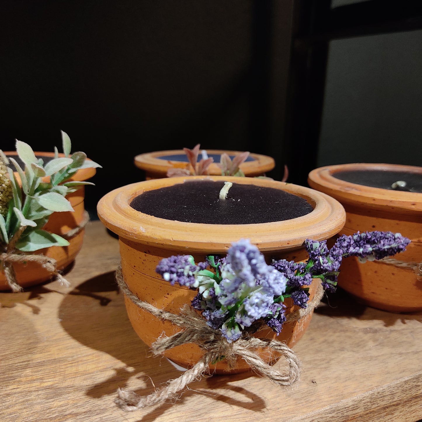 Wax candles in Terracotta pot