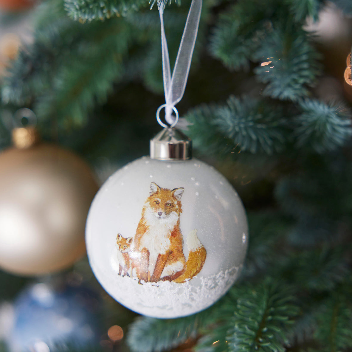 White Christmas ball with animal decoration