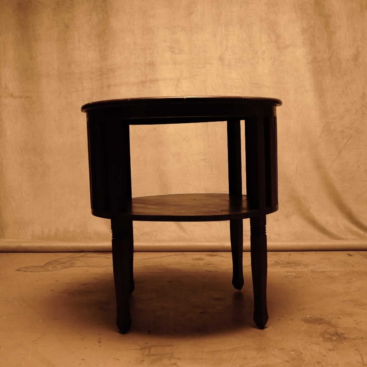 Round teak wood side table with dark shellac colonial style