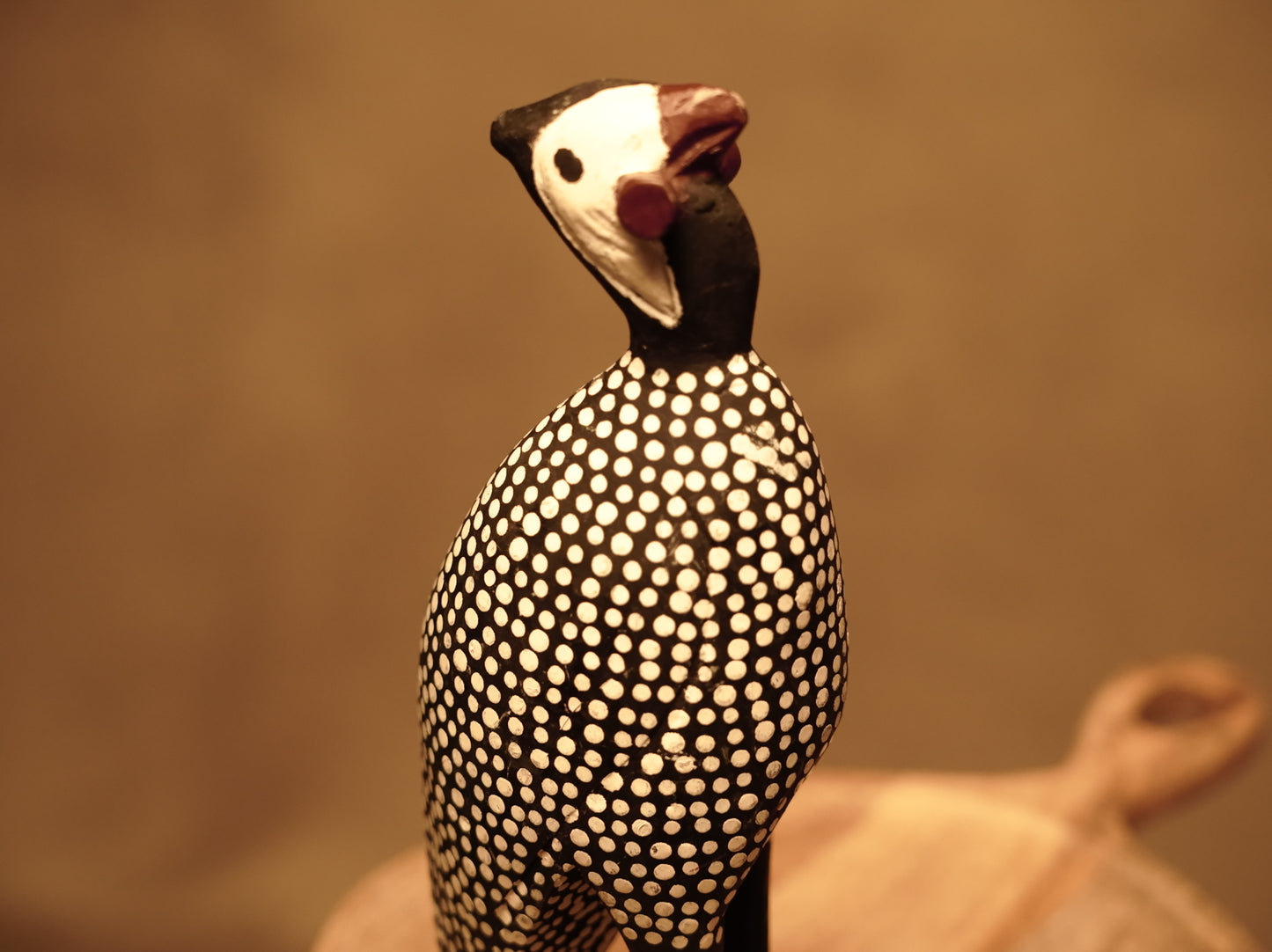 Wooden carved guinea fowl figure