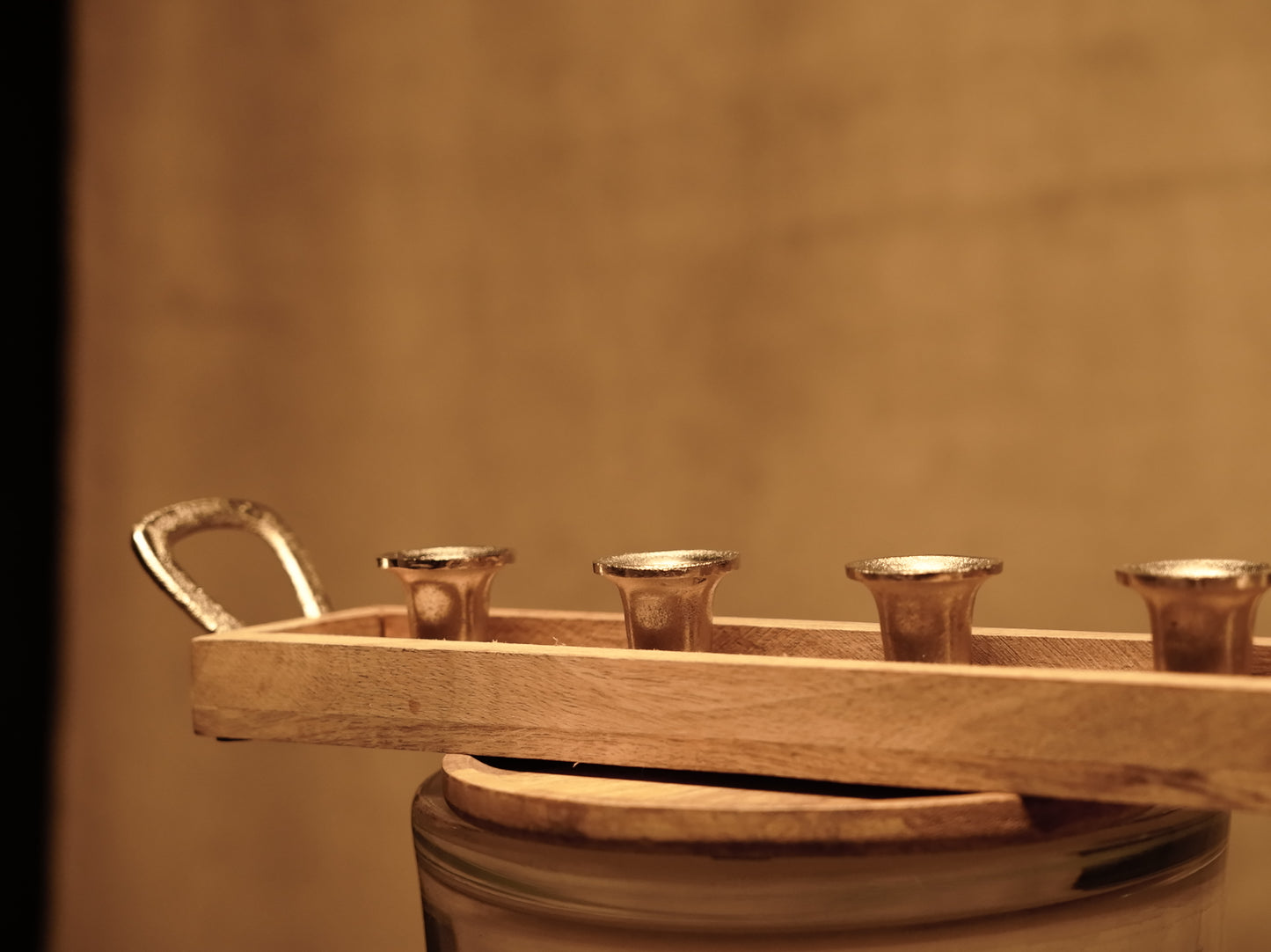 Candle holder made of mango wood and chrome metal