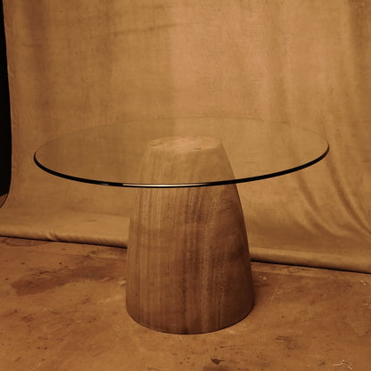 Round table with stone base and glass top