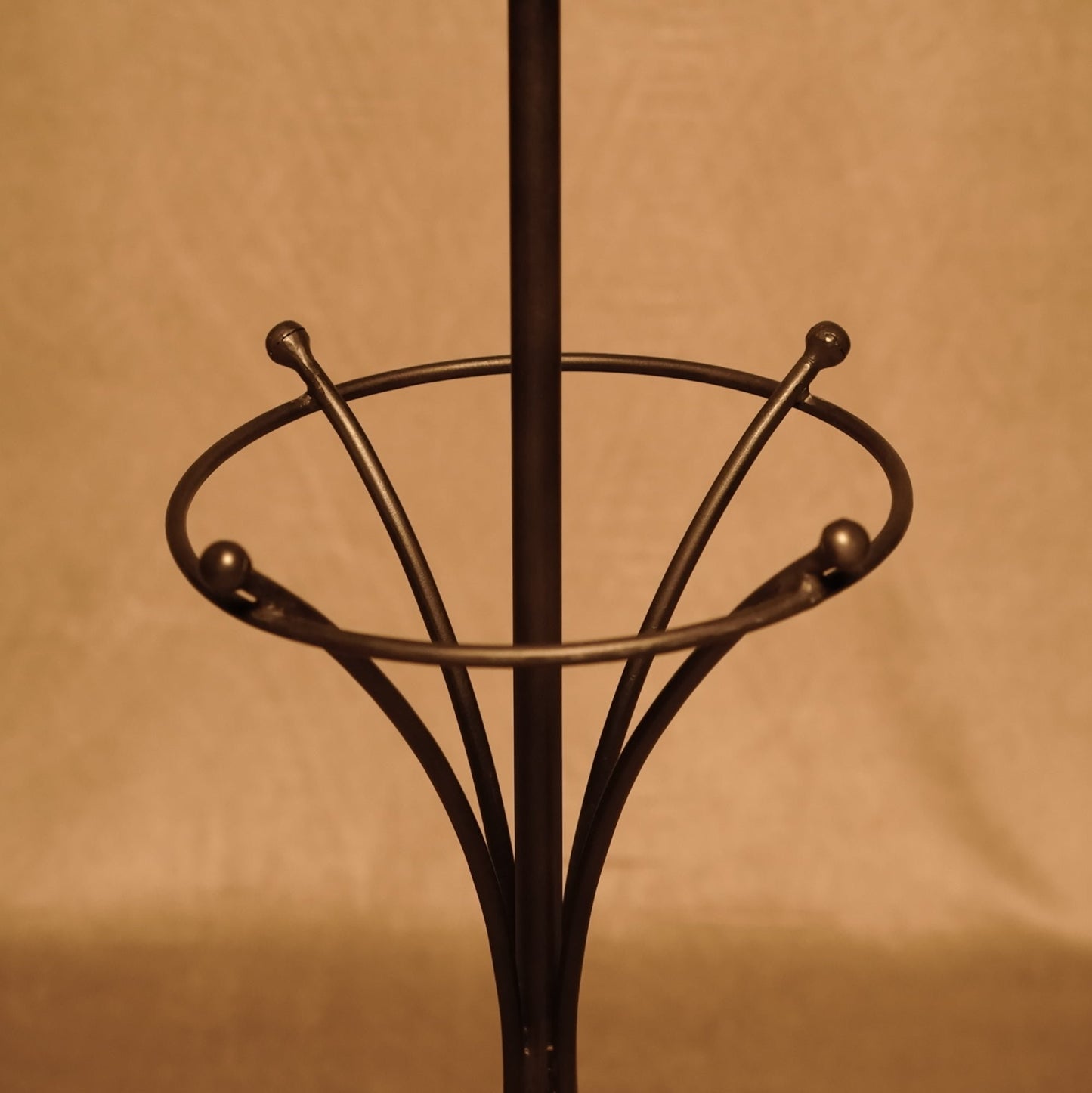 Vintage standing coat rack in wrought metal with bronze finish