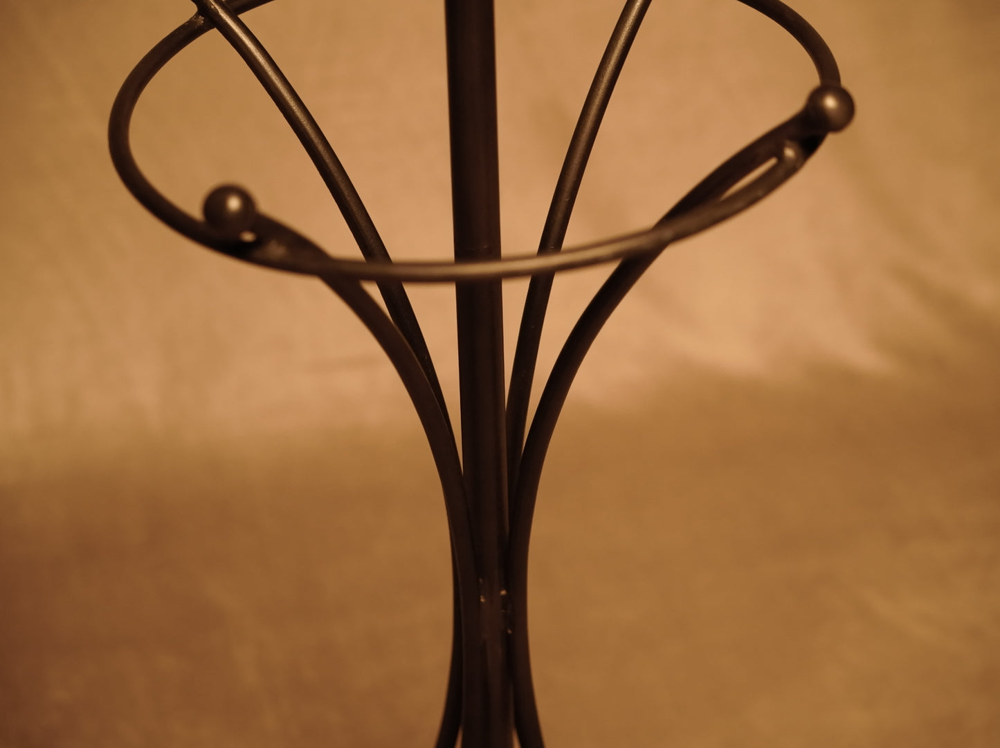 Vintage standing coat rack in wrought metal with bronze finish