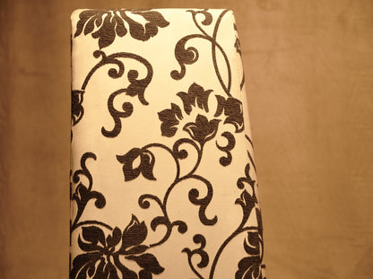 White Upholstered Chair with Black and White Floral Design